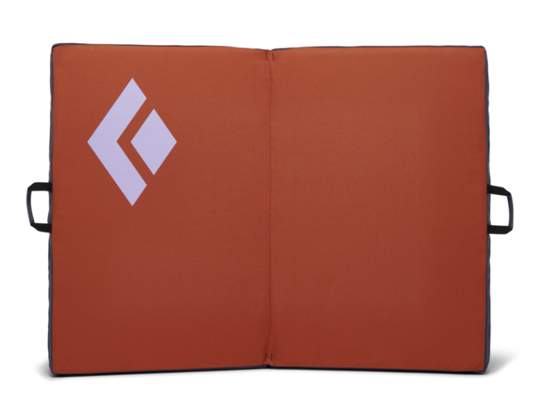Orange bouldering crash pad